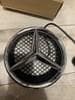 A0008171016 MERCEDES Emblema de la parrilla del radiador